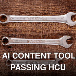 Three metallic wrenches arranged on a rustic wooden table, top view.