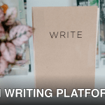 Top view of a notebook labeled 'WRITE' on a glass table with magazines and a potted plant.