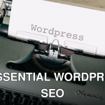 Close-up of a vintage typewriter with a paper displaying 'Wordpress' in retro style.