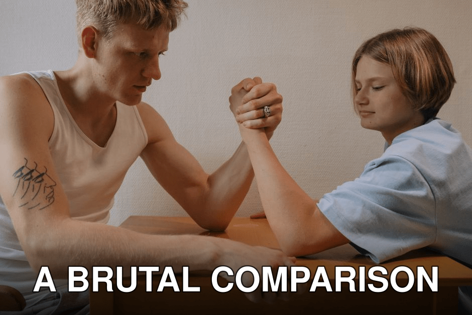 Two siblings engage in a focused arm wrestling match at home.