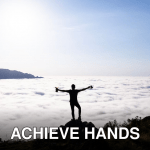Silhouette of a man raising arms on a rocky hilltop above clouds in Artvin, Türkiye