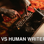 Close-up of tattooed hands typing on a vintage typewriter placed on a patterned carpet, creating a retro feel.