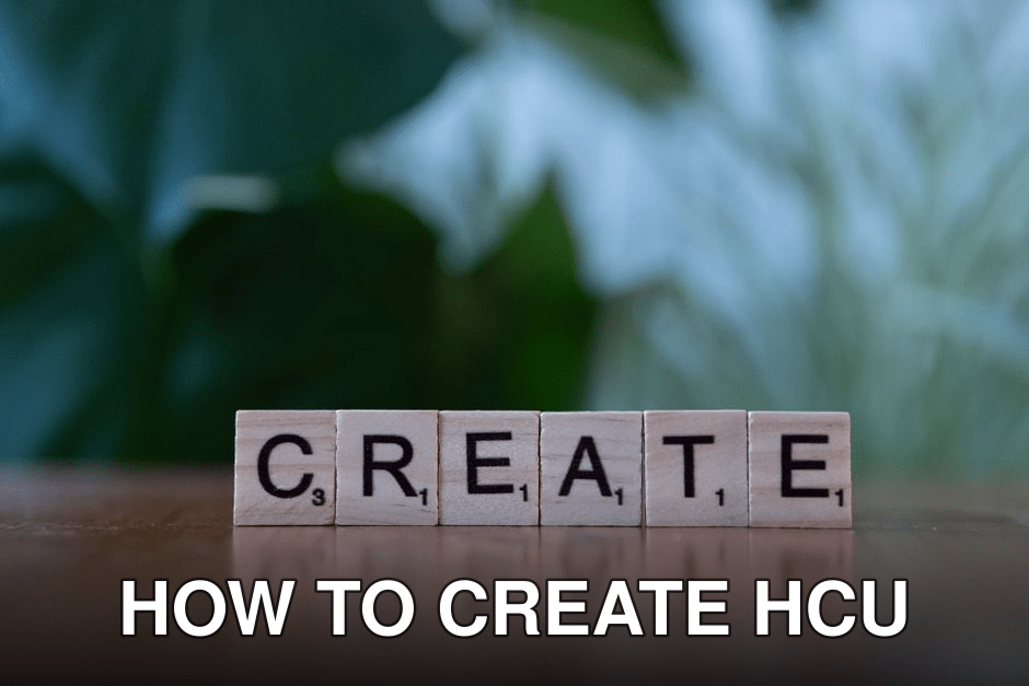 Wooden letter blocks spelling 'CREATE' against a blurred green background.