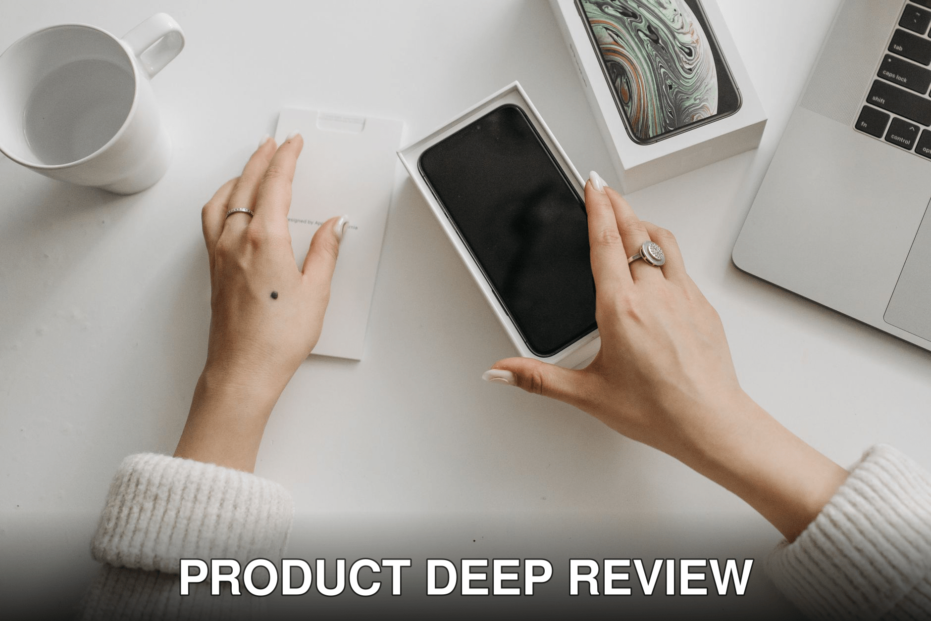 Woman unboxing a smartphone on a white table, showcasing technology and lifestyle