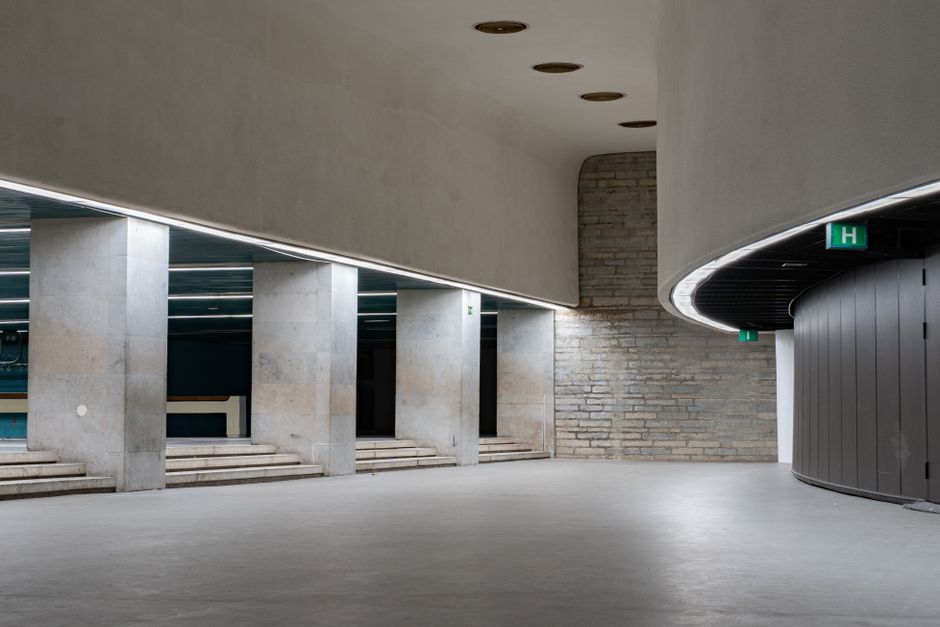 Sleek, minimalist interior design of a spacious concrete hallway in Tallinn, Estonia.