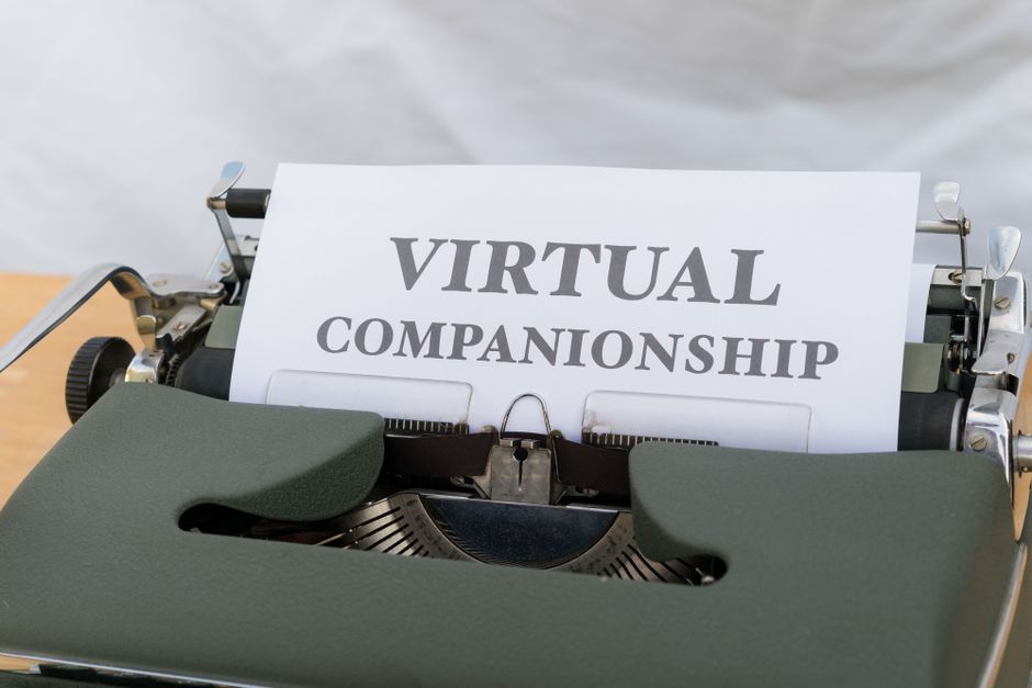 An image of a vintage typewriter with a paper reading 'Virtual Companionship', symbolizing virtual connections.
