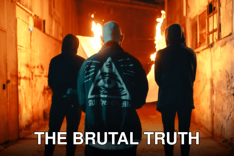 Three hooded figures stand in an urban alley, surrounded by fire at night. Mystery abounds.