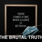 Top view of sterile mask on chalkboard with There Comes A Time When Silence Is Betrayal inscription during COVID 19 pandemic
