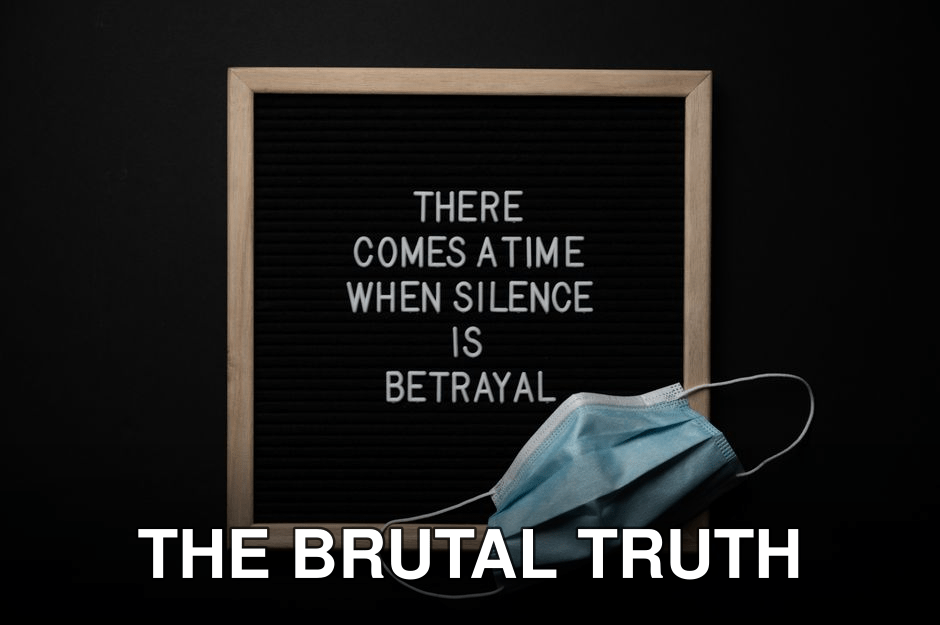 Top view of sterile mask on chalkboard with There Comes A Time When Silence Is Betrayal inscription during COVID 19 pandemic