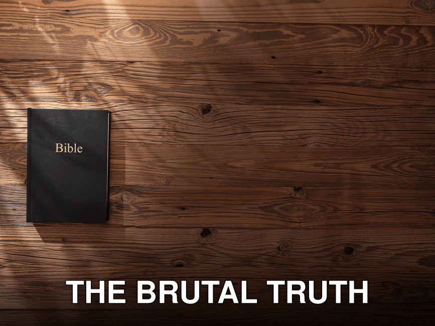 Bible resting on a wooden surface with soft shadows creating a serene atmosphere.