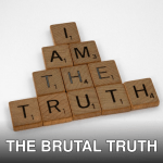 Scrabble tiles arranged on a white surface to spell 'I Am The Truth' in a pyramid shape.