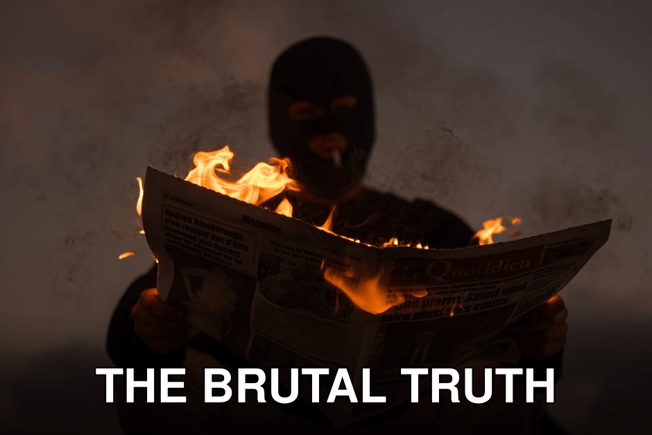 A masked person holds a burning newspaper in dramatic low light, evoking mystery.