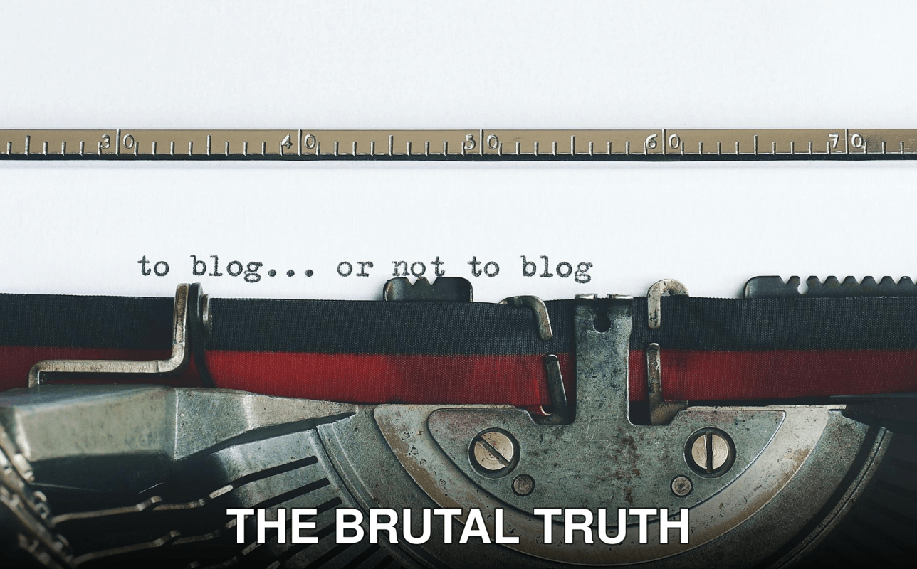Classic typewriter with 'to blog or not to blog' typed on paper.