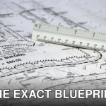 Detailed close-up of architectural blueprints with scale ruler, showing building plans and measurements.