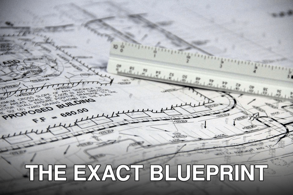 Detailed close-up of architectural blueprints with scale ruler, showing building plans and measurements.