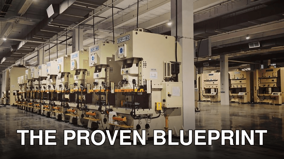 A row of industrial machines on a factory floor, highlighting manufacturing equipment.