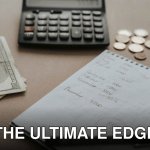Desk setup showing calculator, cash, coins, and financial notes for budgeting.