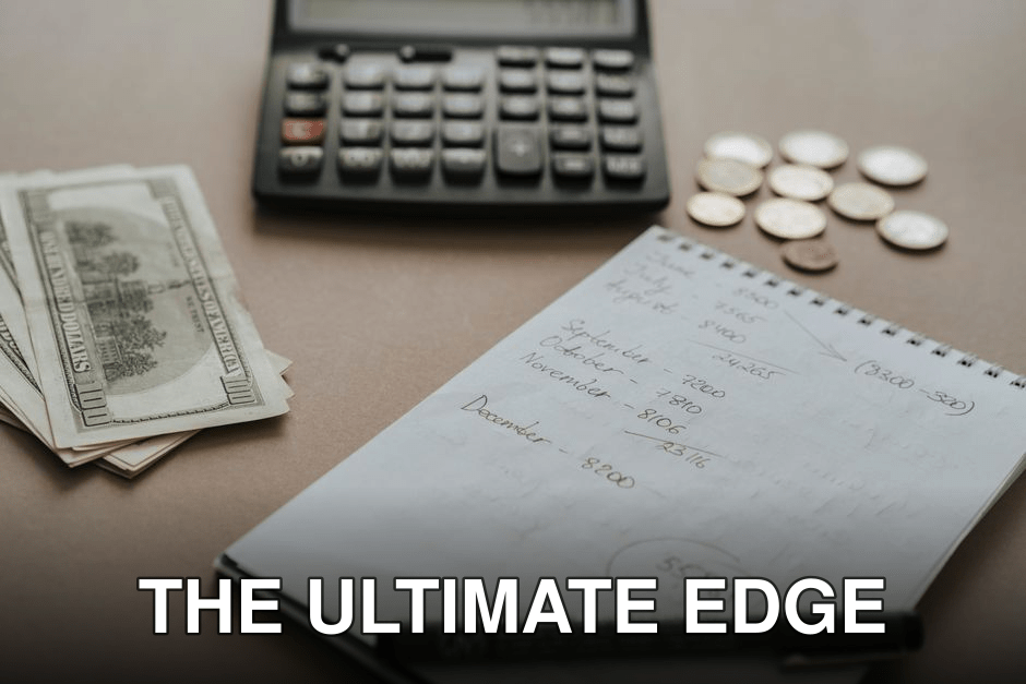 Desk setup showing calculator, cash, coins, and financial notes for budgeting.