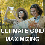 A happy couple using a map and phone in a leafy autumn park.