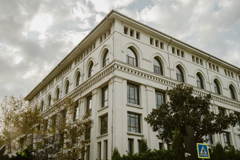 Elegant neoclassical building facade in Istanbul with arched windows and classic architecture.