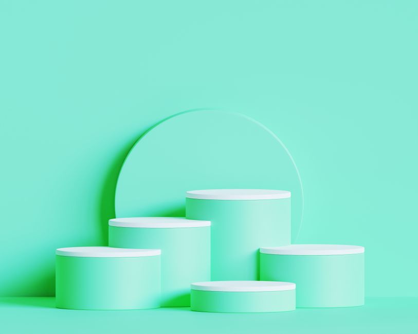 Clean and modern green podiums arranged for product display against a pastel background.