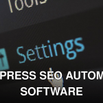 A close-up photo of a computer screen showing the settings button with a cursor hovering over it.