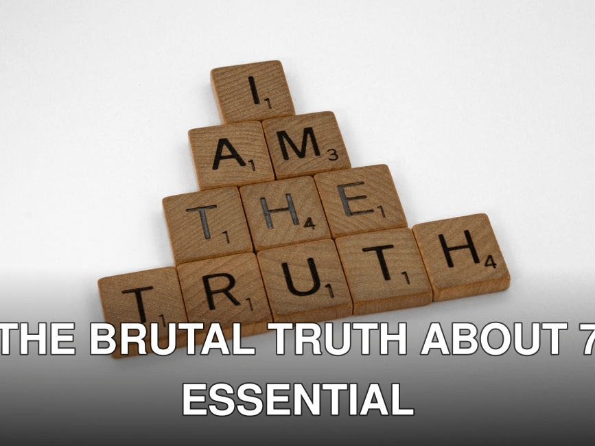 Scrabble tiles arranged on a white surface to spell 'I Am The Truth' in a pyramid shape.