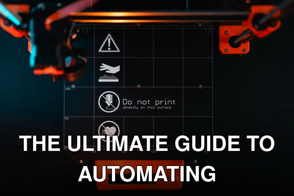 3D printer build plate with warning symbols, showcasing high-tech equipment in a workspace.